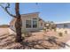 Well-maintained exterior view of property with a covered carport and desert landscaping at 8500 E Southern Ave # 550, Mesa, AZ 85209
