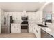 Bright kitchen has stainless appliances, white cabinets, countertops, and a modern faucet at 8500 E Southern Ave # 550, Mesa, AZ 85209