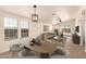 Open-concept living and dining area with wood-look floors, ample natural light, and modern furnishings at 8500 E Southern Ave # 550, Mesa, AZ 85209