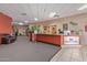 Inviting lobby with a reception desk, comfortable seating, and well-maintained decor and landscaping at 8500 E Southern Ave # 550, Mesa, AZ 85209