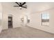 Spacious and bright bedroom with ensuite bath, fan, carpet flooring, and view to closet at 8500 E Southern Ave # 550, Mesa, AZ 85209