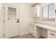 Bright mudroom features a built-in desk and a door to the outside at 8500 E Southern Ave # 550, Mesa, AZ 85209