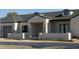 Beautiful single-Gathering home with a stone and stucco exterior, black trim, and a well-manicured front yard at 8521 E Desert Cove Ave, Scottsdale, AZ 85260