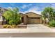Charming single-story home featuring a desert landscape and a convenient two-car garage at 9222 W Roma Ave, Phoenix, AZ 85037