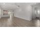 Bright, open-concept living space with modern tiled flooring at 9222 W Roma Ave, Phoenix, AZ 85037