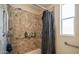 Bathroom features a tiled shower with safety grab bars, enhancing accessibility and safety at 9431 E Coralbell Ave # 6, Mesa, AZ 85208