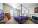 Cozy bedroom with a unique canopy bed frame, soft carpeting, and ample natural light at 9431 E Coralbell Ave # 6, Mesa, AZ 85208