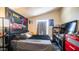 Comfortable bedroom featuring a dark bed frame and stylish decor and wall art at 9431 E Coralbell Ave # 6, Mesa, AZ 85208