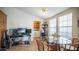 Versatile dining area with laundry nook, featuring natural light and seating for four at 9431 E Coralbell Ave # 6, Mesa, AZ 85208