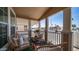 Comfortable front porch seating with stylish cushions and porch railing at 9431 E Coralbell Ave # 6, Mesa, AZ 85208