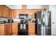 Bright kitchen featuring stainless steel appliances and ample wood cabinetry for optimal storage at 9431 E Coralbell Ave # 6, Mesa, AZ 85208