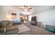 Open concept living area with modern decor, large sofa, and view into kitchen at 9431 E Coralbell Ave # 6, Mesa, AZ 85208
