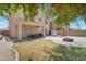 Large backyard featuring a covered patio and room for recreation at 9948 W Chipman Rd, Tolleson, AZ 85353