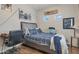 Bedroom featuring a modern decor, hardwood floors and natural light at 9948 W Chipman Rd, Tolleson, AZ 85353