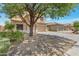 Beautiful two-story home with a two-car garage, long driveway, and xeriscaped yard for low maintenance at 9948 W Chipman Rd, Tolleson, AZ 85353