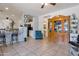 Open concept living room showcasing tile flooring, a decorative cabinet, and an accent chair at 9948 W Chipman Rd, Tolleson, AZ 85353