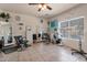 Spacious living room featuring tile floors, decorative lighting, and ample space for various furnishings at 9948 W Chipman Rd, Tolleson, AZ 85353