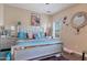 Bedroom featuring an eye-catching mirror trim bedframe and modern decor at 9948 W Chipman Rd, Tolleson, AZ 85353