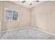 Well-lit bedroom with a window and neutral carpet flooring at 1008 W Heatherwood St, San Tan Valley, AZ 85140