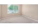 Clean bedroom featuring neutral walls and a window at 1008 W Heatherwood St, San Tan Valley, AZ 85140