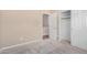 Comfortable bedroom with neutral walls and carpet leading to a closet and hall at 1008 W Heatherwood St, San Tan Valley, AZ 85140