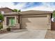 Charming single-story home features a well-maintained yard with attractive landscaping and a two-car garage at 1008 W Heatherwood St, San Tan Valley, AZ 85140