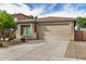 Charming single-story home features a well-maintained yard with attractive landscaping and a two-car garage at 1008 W Heatherwood St, San Tan Valley, AZ 85140