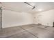 Spacious two-car garage with an automatic door and ample room for storage at 1008 W Heatherwood St, San Tan Valley, AZ 85140