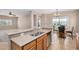 Open kitchen with granite countertops and stainless steel sink at 1008 W Heatherwood St, San Tan Valley, AZ 85140