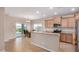 Bright kitchen featuring stainless steel appliances, granite counters, and a dining nook at 1008 W Heatherwood St, San Tan Valley, AZ 85140