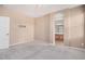 Spacious main bedroom with neutral tones and an ensuite bathroom entrance at 1008 W Heatherwood St, San Tan Valley, AZ 85140