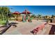 Community playground area with climbing structures, slides, and shaded seating at 1008 W Heatherwood St, San Tan Valley, AZ 85140