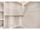 Organized walk-in closet featuring shelving and hanging rods for ample storage at 1008 W Heatherwood St, San Tan Valley, AZ 85140