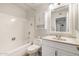 Clean bathroom with a tub-shower combo and an updated vanity and sink at 10222 N 105Th Dr, Sun City, AZ 85351