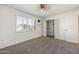 Inviting bedroom with plantation shutters, closet, and soft carpet flooring at 10222 N 105Th Dr, Sun City, AZ 85351