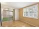 Cozy bedroom with bright windows and plank flooring, great for restful retreat at 10222 N 105Th Dr, Sun City, AZ 85351