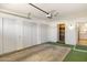 Spacious garage with storage closets, and access to the house at 10222 N 105Th Dr, Sun City, AZ 85351
