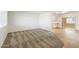 Bright living area with neutral carpet and laminate flooring, offering an open floor plan at 10222 N 105Th Dr, Sun City, AZ 85351