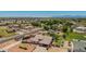 Expansive aerial view of a home with a spacious yard and a beautiful desert landscape and mountain views in the distance at 10535 W San Miguel Ave, Glendale, AZ 85307