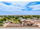 Sprawling property featuring mature landscaping, an RV, and a shed, set against a backdrop of mountains at 10535 W San Miguel Ave, Glendale, AZ 85307