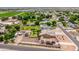 Expansive aerial view shows a large residential property with mature landscaping and ample parking on a sunny day at 10535 W San Miguel Ave, Glendale, AZ 85307