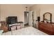 A bedroom with dark wood furniture and access to a closet with mirrored doors at 10535 W San Miguel Ave, Glendale, AZ 85307