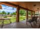 Relaxing covered patio with seating, offering serene backyard views and shade at 10535 W San Miguel Ave, Glendale, AZ 85307