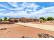 Wide driveway leading to a house with a tile roof, and a three-car garage and gravel landscaping at 10535 W San Miguel Ave, Glendale, AZ 85307