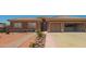 Home offers a welcoming facade with xeriscaped front yard and a spacious two-car garage at 10535 W San Miguel Ave, Glendale, AZ 85307