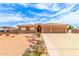 Charming single-story house featuring a tile roof, three-car garage, and low-maintenance desert yard at 10535 W San Miguel Ave, Glendale, AZ 85307