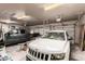 Spacious three car garage with two cars parked inside at 10535 W San Miguel Ave, Glendale, AZ 85307