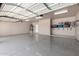 A spacious garage with epoxy floors and storage shelves at 10535 W San Miguel Ave, Glendale, AZ 85307