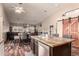 Bright, open concept kitchen with an island and stainless steel dishwasher at 10535 W San Miguel Ave, Glendale, AZ 85307