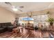 Comfortable living room featuring hardwood floors and an entertainment center at 10535 W San Miguel Ave, Glendale, AZ 85307